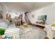 Bright and airy living room with hardwood floors and coastal decor at 4630 Mirabella Ct, St Pete Beach, FL 33706