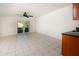 Bedroom with tile floors and access to patio at 4630 Mirabella Ct, St Pete Beach, FL 33706