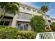 Building exterior showcasing architectural details and landscaping at 4630 Mirabella Ct, St Pete Beach, FL 33706