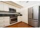 Modern kitchen with stainless steel appliances and ample cabinet space at 4630 Mirabella Ct, St Pete Beach, FL 33706