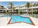 Inviting community pool with ample lounge chairs at 4630 Mirabella Ct, St Pete Beach, FL 33706