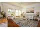 Bright and airy living room with hardwood floors and coastal decor at 4630 Mirabella Ct, St Pete Beach, FL 33706