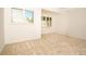 Well lit bedroom with neutral carpeting and window coverings at 4630 Mirabella Ct, St Pete Beach, FL 33706