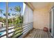 Relaxing screened balcony with pool and garden view at 4630 Mirabella Ct, St Pete Beach, FL 33706