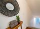 Elegant upstairs hall with a decorative mirror at 4630 Mirabella Ct, St Pete Beach, FL 33706