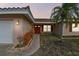 House exterior with a red door and walkway at 529 Johns Pass Ave, Madeira Beach, FL 33708