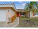 House exterior with a red door and walkway at 529 Johns Pass Ave, Madeira Beach, FL 33708