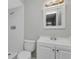 Clean bathroom, featuring a toilet, shower, vanity, and mirror at 609 Missionwoode Dr, Seffner, FL 33584