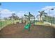 Community playground with swings and play structures at 6232 French Creek Ct, Ellenton, FL 34222