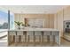 Modern kitchen with marble countertops and island, stainless steel appliances, and light wood cabinetry at 1000 Water St # 1702, Tampa, FL 33602