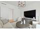 Living room with comfortable seating and large TV at 1000 Water St # 1702, Tampa, FL 33602