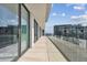 Private balcony with glass railings and city views at 1000 Water St # 1702, Tampa, FL 33602