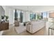 Open living space with floor-to-ceiling windows and city views at 1000 Water St # 1702, Tampa, FL 33602