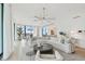Open living space with white sectional sofa and stunning city views at 1000 Water St # 1702, Tampa, FL 33602