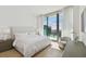 Spacious bedroom with a king-size bed and stunning city views at 1000 Water St # 1702, Tampa, FL 33602