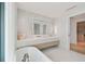 Spa-like bathroom with marble finishes and double vanity at 1000 Water St # 1702, Tampa, FL 33602