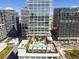 Luxury building with a rooftop pool and lush landscaping at 1000 Water St # 1702, Tampa, FL 33602
