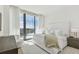 Bright bedroom with a king-size bed and access to a private balcony at 1000 Water St # 1702, Tampa, FL 33602