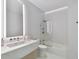 Modern bathroom with a bathtub, shower, and sleek vanity at 1000 Water St # 1702, Tampa, FL 33602