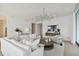 Bright living room with white sofa, large TV, and modern decor at 1000 Water St # 1702, Tampa, FL 33602