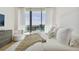 Spacious bedroom with city views, plush bedding, and comfortable seating area at 1000 Water St # 1702, Tampa, FL 33602