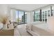 Bright bedroom with a king-size bed, balcony access, and city views at 1000 Water St # 1702, Tampa, FL 33602