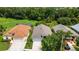 Aerial view showcases the home's location with well-maintained lawns and backyard green space at 27542 Sky Lake Circle, Wesley Chapel, FL 33544