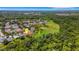 Expansive aerial shot showcases home's peaceful setting with natural backdrop and community, highlighting spacious outdoor living at 27542 Sky Lake Circle, Wesley Chapel, FL 33544