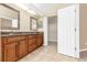 Bathroom boasts double sinks, granite countertops, and access to closet space for optimal storage at 27542 Sky Lake Circle, Wesley Chapel, FL 33544