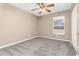 Bedroom boasts new carpet, neutral paint, and a sunny window view; perfect for relaxation at 27542 Sky Lake Circle, Wesley Chapel, FL 33544