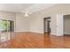Spacious bedroom features wood floors, ceiling fan, and sliding glass doors leading to the outdoors at 27542 Sky Lake Circle, Wesley Chapel, FL 33544