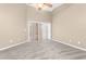 Neutral bedroom with a ceiling fan, carpeting, and sliding glass doors to a private balcony at 27542 Sky Lake Circle, Wesley Chapel, FL 33544