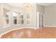 Dining room featuring hardwood floors, neutral paint, ample natural light, and sliding glass doors at 27542 Sky Lake Circle, Wesley Chapel, FL 33544