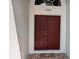 Double front door with address number 27542 above it and a decorative welcome mat at 27542 Sky Lake Circle, Wesley Chapel, FL 33544