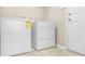 Bright laundry room with white washer and dryer at 27542 Sky Lake Circle, Wesley Chapel, FL 33544