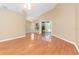 Bright and airy living room features gleaming hardwood floors, high ceilings, and sliding glass doors at 27542 Sky Lake Circle, Wesley Chapel, FL 33544