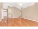 Spacious living room with hardwood floors, neutral paint, a ceiling fan, and an open floor plan at 27542 Sky Lake Circle, Wesley Chapel, FL 33544
