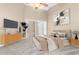 Cozy main bedroom with soft carpet, vaulted ceiling, and a large window at 27542 Sky Lake Circle, Wesley Chapel, FL 33544