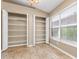 Spacious pantry room featuring built in shelving with bright natural light from the window at 27542 Sky Lake Circle, Wesley Chapel, FL 33544