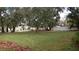 Large backyard with mature trees at 3706 Joe Sanchez Rd, Plant City, FL 33565