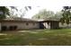 Tan brick house with screened porch at 3706 Joe Sanchez Rd, Plant City, FL 33565