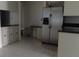 Kitchen features stainless steel appliances and dark countertops at 3706 Joe Sanchez Rd, Plant City, FL 33565