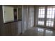 Laundry area with built-in cabinets and French doors at 3706 Joe Sanchez Rd, Plant City, FL 33565