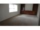 Living room with built-in shelving and carpeting at 3706 Joe Sanchez Rd, Plant City, FL 33565