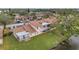 Aerial view of condo building showcasing private patio and lake access at 3840 Staysail Ln # 3840, Holiday, FL 34691