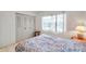 Bedroom with a double bed and large window with blinds at 3840 Staysail Ln # 3840, Holiday, FL 34691