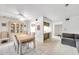 Bright dining room with table, chairs, and access to living room at 3840 Staysail Ln # 3840, Holiday, FL 34691