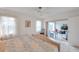 Bedroom with king-size bed, window, and view of sunroom at 3840 Staysail Ln # 3840, Holiday, FL 34691