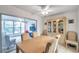 Dining room with table, chairs, and view of enclosed patio at 3840 Staysail Ln # 3840, Holiday, FL 34691