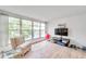 Sunroom features lake view, TV, and plenty of natural light at 3840 Staysail Ln # 3840, Holiday, FL 34691